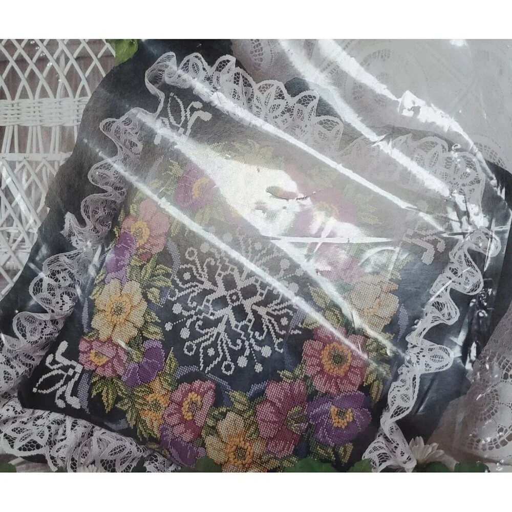 Something Special Counted Cross Stitch Kit #50687 wreath on black pillow.